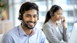 © N7 - Indian Telecom Call Center Agent – Portrait of an Indian call center agent providing customer service over the phone.