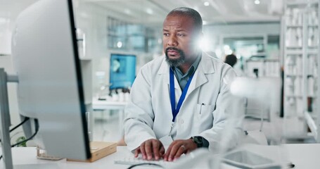 Wall Mural - Black man, doctor and typing on computer in lab for medical research, experiment report and results information. Serious, scientist and pc for test feedback, innovation and pharmaceutical development