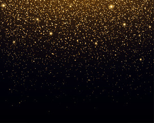 golden glittering background. shiny dust, bokeh effect. magic falling golden lights and stars.