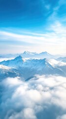 Wall Mural - An aerial view of a mountain range with snow-capped peaks, deep valleys, and clouds drifting over the landscape, creating a majestic and awe-inspiring scene