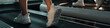 © DragonImages - Header with people walking on treadmill in fitness club