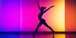 © Iryna - A woman is dancing in front of a colorful wall. Concept of energy and movement, as the woman's body is in motion and the colors of the wall create a dynamic and vibrant atmosphere