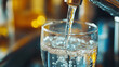 © Cavad - Close-up of water being poured from a tap into a glass. Represents drinking water.