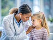 © Man888 - A compassionate doctor gently examines a young patient's head, her concerned expression as she listens to their symptoms in a hospital clinical setting.