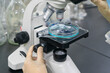 © onlyyouqj - The research institute observes reagents under a microscope