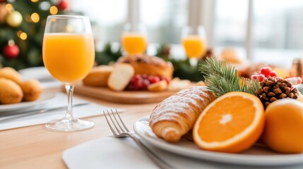 Close-up of a festive holiday brunch being served, with a spread of delicious pastries, fruits, and drinks on the table.