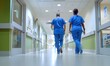 © Imagentive - Hospital Staff Walking Down Hallway in Scrubs