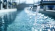 © Dulemegapixel - A pristine stream of clear water pours from a pipeline into a clean pool, creating ripples and highlighting the freshness and purity of the water in an industrial or filtration setting.