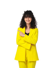 Canvas Print - Beautiful young woman in stylish yellow suit pointing at something on white background