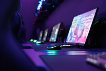 Poster - Professional gaming table with gaming PC, headset, keyboard, mouse and monitor with neon light.