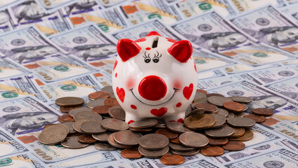 Wall Mural - Funny piggy bank and various American coins against the background of 100 US dollar bills