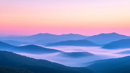 Wall Mural - Mountain landscape at sunrise with foggy valleys