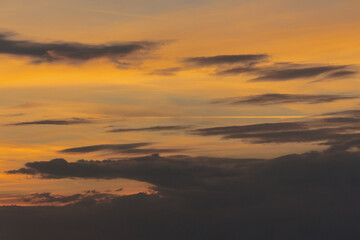 Wall Mural - dramatic cloud formations at dusk. changing weather forecast. glowing sky