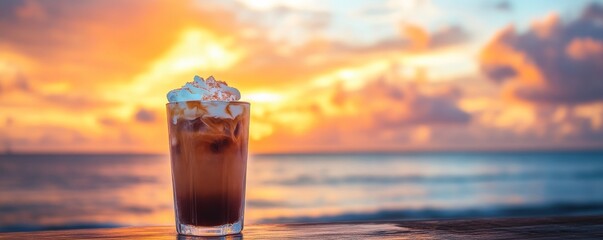 Wall Mural - Iced coffee on wooden table with sunset