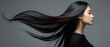 © raja - Beautiful asian coasian woman with long hair posing in studio on grey background. Women Hair Is Fluttering In The Wind