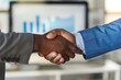© SKIMP Art - Close-up of two business people shaking hands in an office One is a Black man, and the other is a White man wearing a blue suit jacket Generative AI