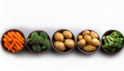 a row of bowls with various types of vegetables including carrots potatoes