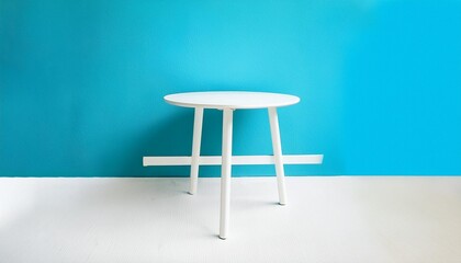 modern white table with legs and free space blue wall texture in background