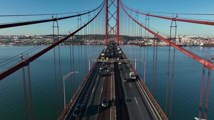 Poster - The 25 April bridge (Ponte 25 de Abril) located in Lisbon, Portugal, crossing the Targus river. Drone. 4k