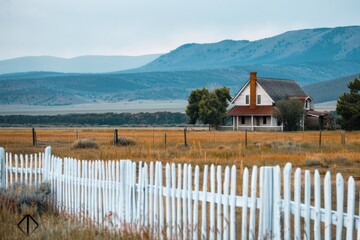 Aufkleber - A classic American-style house with a white picketed fence in front, suitable for home decor and real estate imagery