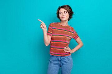 Sticker - Photo of cute woman with bob hairstyle dressed striped t-shirt indicating look at empty space offer isolated on turquoise color background