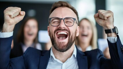 Wall Mural - A man in a suit is smiling and raising his hands in the air