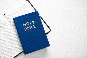 Wall Mural - Open Holy Bible on white textured background