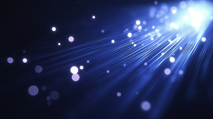 Abstract blue light streaks with white bokeh dots in the background.