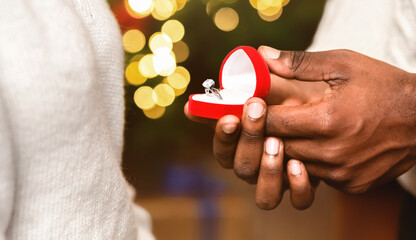 Sticker - Engagement concept. Male hands opening gift box with diamond ring for christmas, closeup