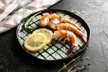 Poster - Plate with tasty boiled shrimps, rosemary and lemon on black background