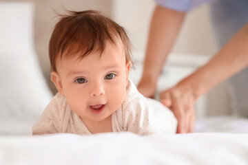 Poster - Cute little baby getting massage on bed, closeup