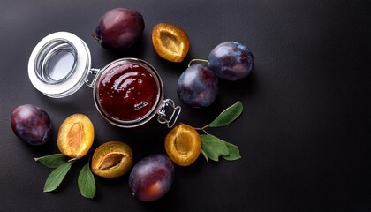 Wall Mural - plum jam and fresh berries on a black background