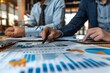 © panu101 - Confident Business Team Analyzing Market Data to Plan Growth Strategies