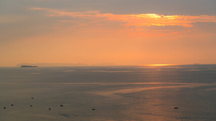 Wall Mural - beautiful view of golden sea and sky in the evening, natural background