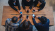© aFotostock - Top view of Multi Ethnics Teamwork Collaboration Team Meeting Communication concept Conference Room. Diversity Partner Business Meeting brainstorming hand holding mobile laptop smartphone technology