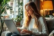 © kitipol - A brightly lit, high-resolution image of a young woman marketer, her expression focused as she types on her laptop, the scene styled to reflect a high-end lifestyle