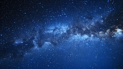 A stunning view of the Milky Way galaxy on a dark night, with countless stars sparkling against the dark blue sky.