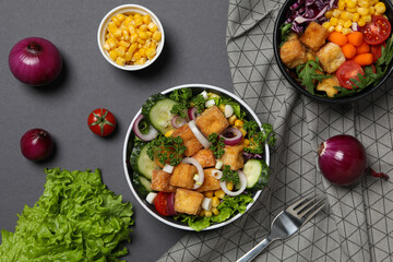 Wall Mural - Fried tofu salad in a bowl, top view