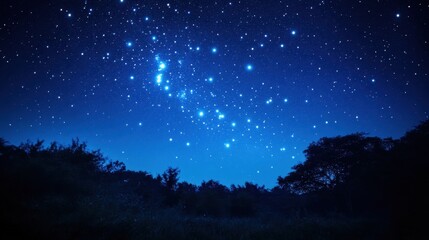 tranquil blue night sky with stars scattered across the horizon, a peaceful cosmic scene.
