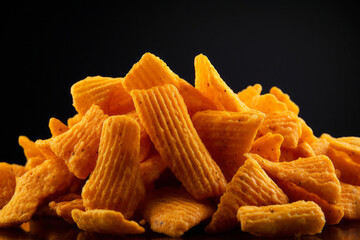 Processed collage of orange snack chips macro photo. Background for banner, backdrop or texture