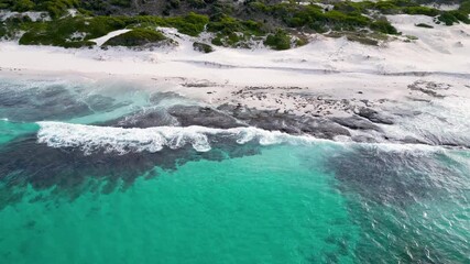 Wall Mural - Aerial views over turquoise blue water and white sandy beach in Tasmania, Australia