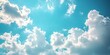 © Thanthara - Sunny day with white clouds and blue sky, perfect for backgrounds and wallpapers. nature's beauty captured.