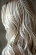 © kura - Close-up of wavy platinum blonde hair texture