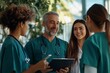 © Timur - Doctors and nurses collaborating with tablet for patient diagnosis teamwork in medical research