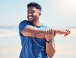 © Azee Jacobs/peopleimages.com - Man, happy and stretching arms by beach for warm up, daily workout routine and fitness for muscle development. Male person, thinking and flexing for physical cardio, training or exercise for health.