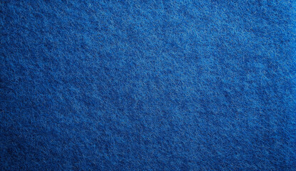 close-up of a blue felt fabric texture with soft fibers.