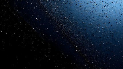 Wall Mural - Close-up of a textured surface with droplets against a dark background.