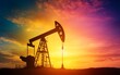© NEW - Silhouette of an oil pump against a vibrant sunset sky, symbolizing energy production and the oil industry.