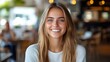 © At My Hat - Smiling young woman in a cafe. Perfect for promoting healthy and happy lifestyles, or for use in beauty and fashion advertising.