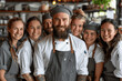 © btiger - Group Of Happy Chefs Posing Together In Restaurant Kitchen Smiling